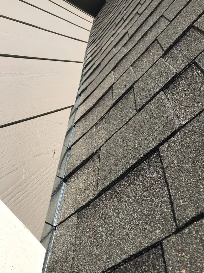 Corner of roof with new shingles