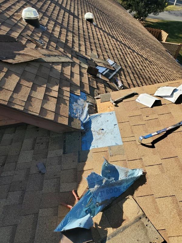 Roof damage with shingles missing